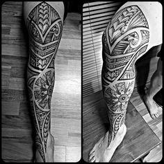 the legs and ankles of a man with tattoos on them, both in black and white