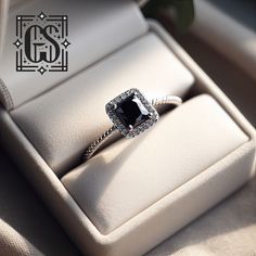 an engagement ring with a black diamond in it