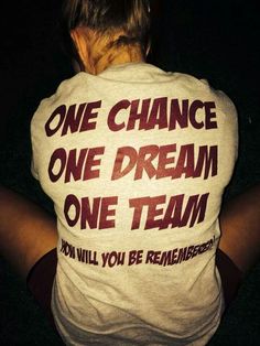 a person wearing a shirt that says, one chance one dream one team don't will you be remembers?