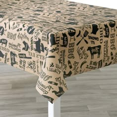 a table covered in black and white farm animals on it's sides, with the words