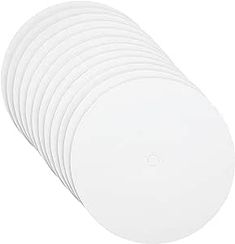 six white plates stacked on top of each other