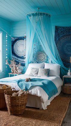 a bedroom with blue walls and white bedding, wicker baskets on the floor