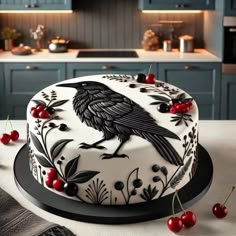 a decorated cake sitting on top of a kitchen counter next to cherries and berries