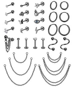 an assortment of metal hardware and chains on a white background