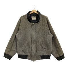 PLEASE ASK ANY QUESTION BEFORE BUYING  THIS IS USED CLOTHING PLEASE DON'T EXPECTED IT TO BE LIKE NEW OR IN PRISTINE CONDITION!! Vintage 90s Harris Tweed Wool Bomber Jacket  Tag Harris Tweed Material wool Size on tag L (large) Measures About (Approximately)  -Armpit to Ampit : 24.5 inch  -Length (back collar down) : 28 inch -Shoulders : 21 inch  -Sleeve Length : 23 inch Condition : used good condition  9/10 **No Tears, No Stains And No Holes** PLEASE READ THE DESCRIPTION AND POLICY BEFORE BUYING Casual Winter Tweed Jacket, Retro Winter Tweed Jacket With Pockets, Retro Tweed Jacket With Pockets For Winter, Retro Tweed Outerwear, Retro Long-sleeved Tweed Outerwear, Retro Long Sleeve Tweed Outerwear, Winter Retro Long Sleeve Tweed Jacket, Vintage Black Long Sleeve Tweed Jacket, Casual Tweed Sport Coat For Winter