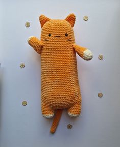 an orange stuffed animal laying on top of a table