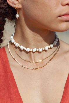 This luxurious gold and puka shell necklace evokes visions of Hawaii's white sands and soothing shores. Layer this with other beaded beauties and you'll be ready for your tropical escape. ✦ DETAILS ✦ ✧ Name: Keone (keh-OH-neh) - Sand ✧ Adjustable Length. ✧ White Puka Shells. ✧ 14kt Gold Filled with lobster clasp. ✧ All Ke Aloha Jewelry pieces come packaged thoughtfully, beautifully, and ready for gift giving. ✦ MORE GOLD NECKLACES ➤ http://www.etsy.com/shop/kealohajewelry?section_id=11346397 ✦ S Luxury Shell Necklaces For Beach, Kukuiula Necklace Bead, White Beachy Jewelry For Vacation, Beachy White Jewelry For Vacation, White Strand Shell Necklace With Beachy Style, White Strand Shell Necklace For Beach, White Strand Jewelry For The Beach, White Beachy Jewelry For The Beach, White Beachy Jewelry For Beach