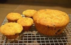 several muffins cooling on a wire rack