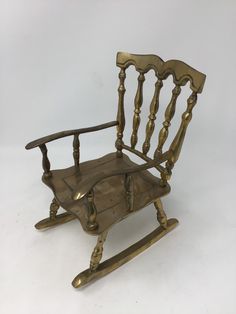 an old fashioned rocking chair on a white background