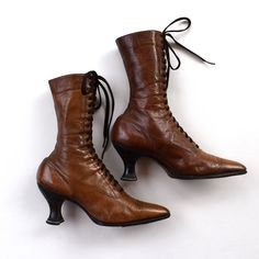 "This listing is for a pair of antique thin brown leather lace up high ankle Edwardian boots lined with cotton twill. These are very narrow with a sharp pointed toes, full lace front, Louis heel and narrow ankles. These boots have 19 grommets and perforated decoration at the toe. Their tongues are lined with cotton fabric. I didn't find a size or maker mark on these antique boots, only numbers inside: 242 51409. The leather and cloth are supple but the stitching is undone on the top of the right boot. The boots are about 12 1/2\" tall by 2 3/4\" wide at the widest part of the sole and the length of the sole is about 9 1/2\" long. The leather is very thin and very soft. These boots were a part of a nice Edwardian collection of one of the estate sales. When I found them, they were stuffed wi Witchy Shoes, Edwardian Boots, Brown Leather Lace Up Boots, Granny Boots, Victorian Boots, Shabby Style, Leather Lace Up Boots, Boots Brown, Long Boots