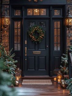 the front door is decorated with christmas lights and wreaths