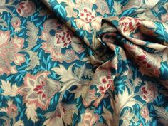 a blue and pink floral print fabric