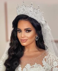 kim kardash is wearing a tiara and wedding dress for the first time