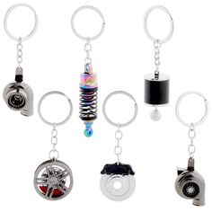 six key chains with different types of items hanging from them, all in various shapes and sizes