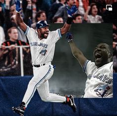 a baseball player is jumping in the air with his arms up and hands raised above his head