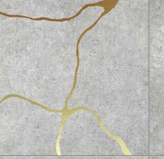 an abstract painting on concrete with gold lines