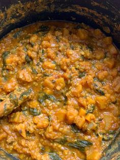 a large pot filled with some food on top of a table