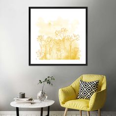 a yellow chair sitting in front of a white table with a vase on top of it