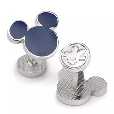 mickey mouse cufflinks are shown in silver and blue