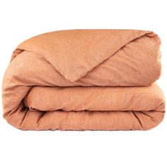 an orange comforter is folded on top of each other