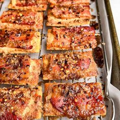 many square pieces of food on a tray