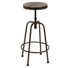 the stool is made from metal and has a black seat with an iron frame on it