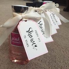 three wine bottles with labels on them sitting on the floor in front of a carpeted area