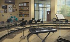 an empty room with chairs and musical instruments