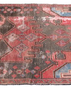 an old rug with many different colors and patterns