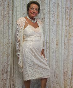 "Lovely in the 80's - this dress could easily be worn as a 20's or 30's costume... or... just dress up and enjoy it! Lovely in lace, this soft peach with lace overlay is a yummy taffeta fabric with rayon lace atop. Nicely finished with appliques on the lace jacket for added frill. Spaghetti strap gown rides just below the knee for a comfortable fit. The little lace jacket is sweet as can be! Jacket sleeves are long and lace - no underlay.  This 1980's cocktail dress is made by a la Carte of Cali Spaghetti Strap Gown, Vintage Culture, Fancy Appetizers, Lingerie Gown, Wild Oats, Chic Over 50, Dress With Jacket, Stuffed Pepper, Classy Lady