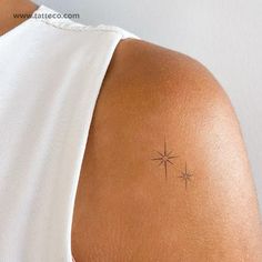 a woman with a small star tattoo on her back shoulder and upper half of the arm