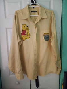 I hand painted this Winnie the pooh shirt. This is a men's XL, dress shirt. Pooh Shirt, Painted Shirt, Winnie The Pooh Shirt, Childhood Memories 2000, Mens Dress Shirts, Paint Shirts, Cape Canaveral, Mens Dress, Tee Dress