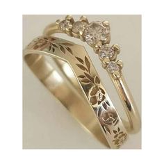 two gold wedding rings with flowers and leaves on each band, one has a diamond in the center