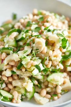 a white bowl filled with lots of veggies