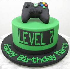 a birthday cake with a video game controller on top