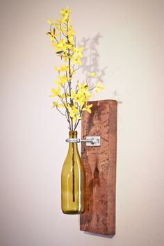 Decorative wine bottle vase mounted on a rustic wood plank. Flowers not included. Some assembly required. Wine Bottle Wall Decor, Vine Bottle, Wine Bottle Wall, Wine Bottle Vases, Easy Wood, Bottle Wall, Wall Vase, Wine Bottle Decor, Rustic Walls