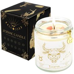 the zodiac candle is in front of a box