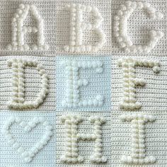 crocheted letters and numbers are displayed on a blanket that reads abc, d, e, f