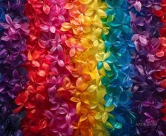 a rainbow colored background with lots of different colors and shapes in the shape of flowers