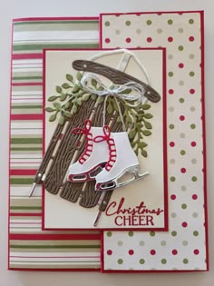 a handmade christmas card with a pair of skis