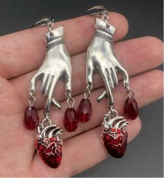 Creep out all your friends with these bleeding heart Goth earrings. Heart And Hand, Heart Organ, Hand Earrings, Blood Drop, Hand Heart, Goth Earrings, Color Heart, Red Blood, Heart Hands