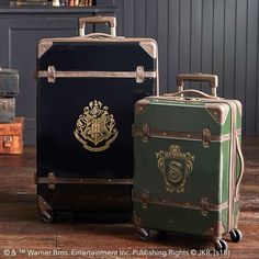 three suitcases sitting on top of a wooden floor