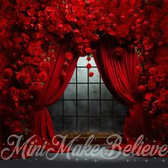 a window with red curtains and roses on it