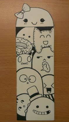 an image of a skateboard with cartoon characters on it's back side and the bottom half painted black and white