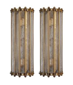 pair of brass sconces with glass panels