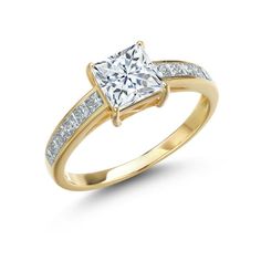 a yellow gold ring with a princess cut diamond and channel set diamonds on the sides