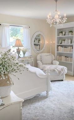 a living room filled with furniture and a chandelier