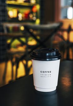 a coffee cup sitting on top of a table