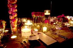 the table is set with candles and menus