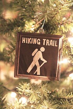 a hiking trail ornament hanging from a christmas tree